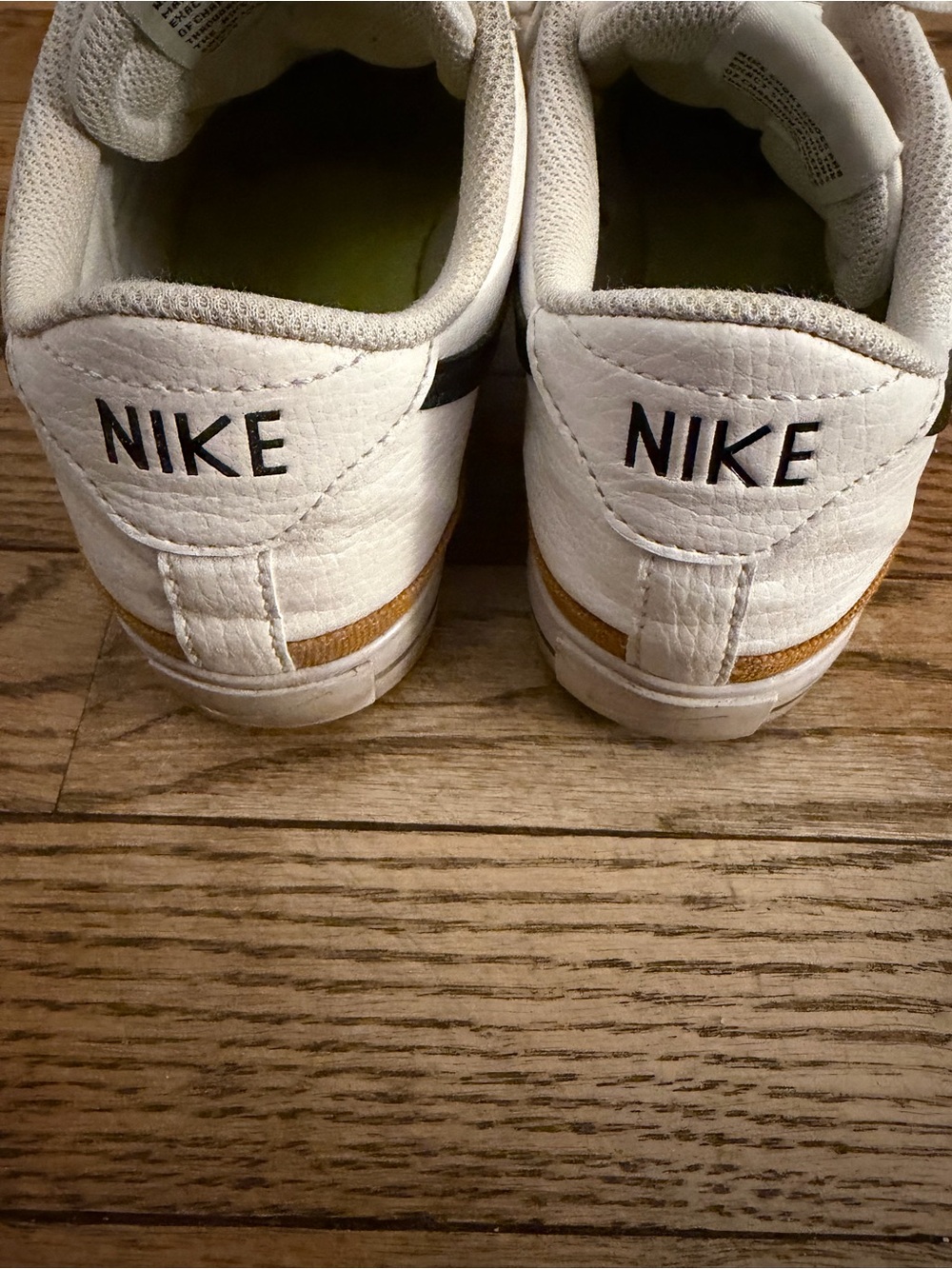 Nike White Sneakers with Black Swoosh and Gold Accent - Picture 3 of 5